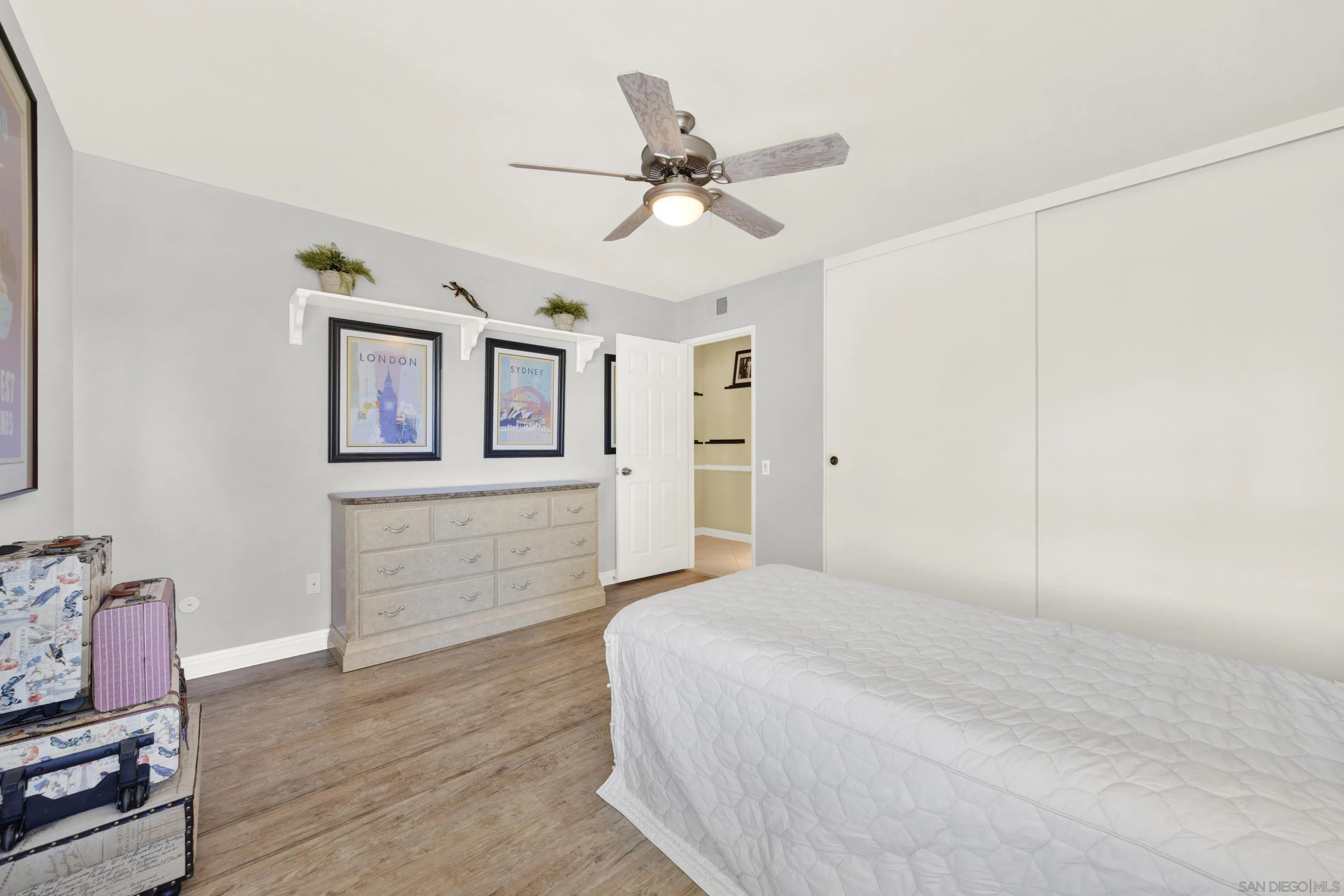 17233 Cuvee Court Poway, CA 92064 - Photo 39 of 53 a bedroom with a bed and a chandelier