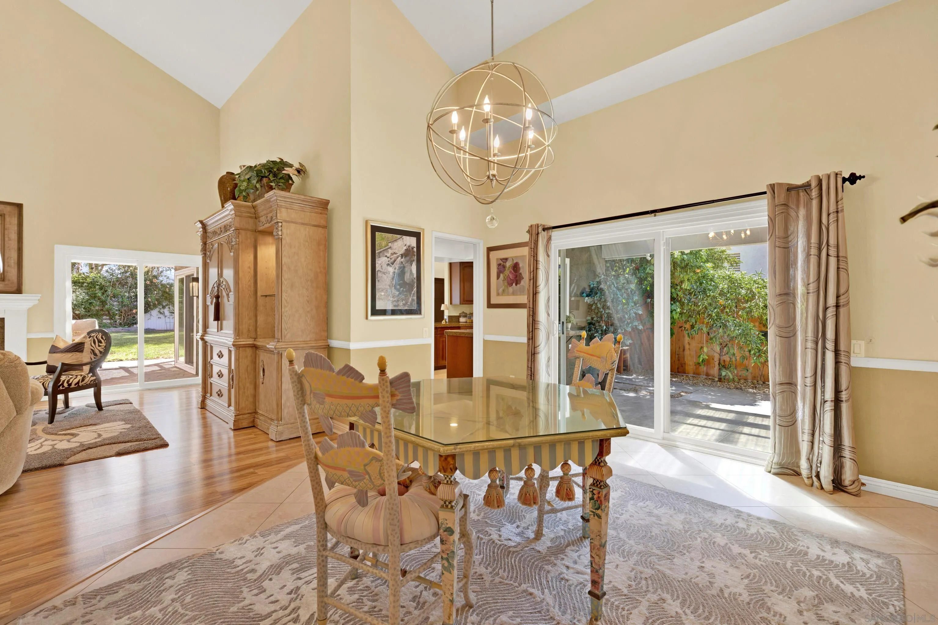 17233 Cuvee Court Poway, CA 92064 - Photo 8 of 53 a dining room with furniture a chandelier and wooden floor