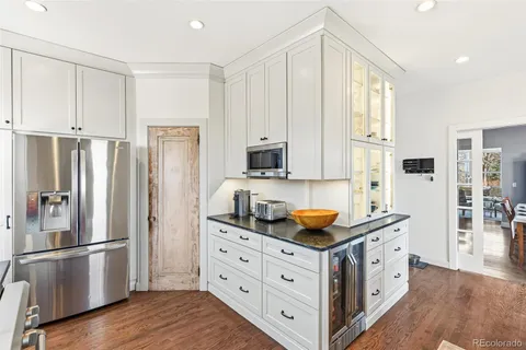 a kitchen with stainless steel appliances granite countertop a refrigerator sink and cabinets