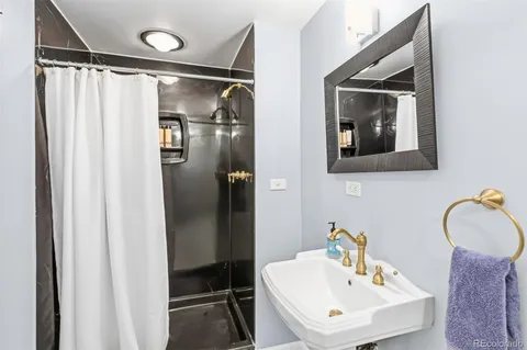 a bathroom with a sink and mirror