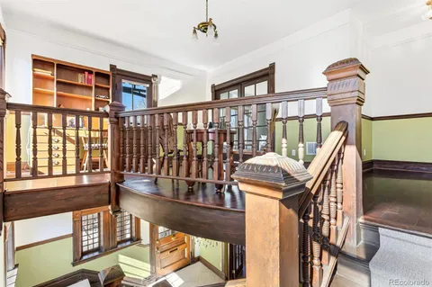 a view of a livingroom with furniture and hardwood floor