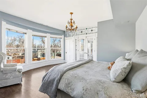 a bedroom with bed and window