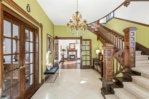 a view of a livingroom with furniture and floor to ceiling window