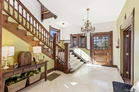 a view of entryway and hall with dining room