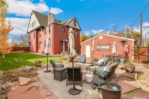 a view of a house with a snow in the yard