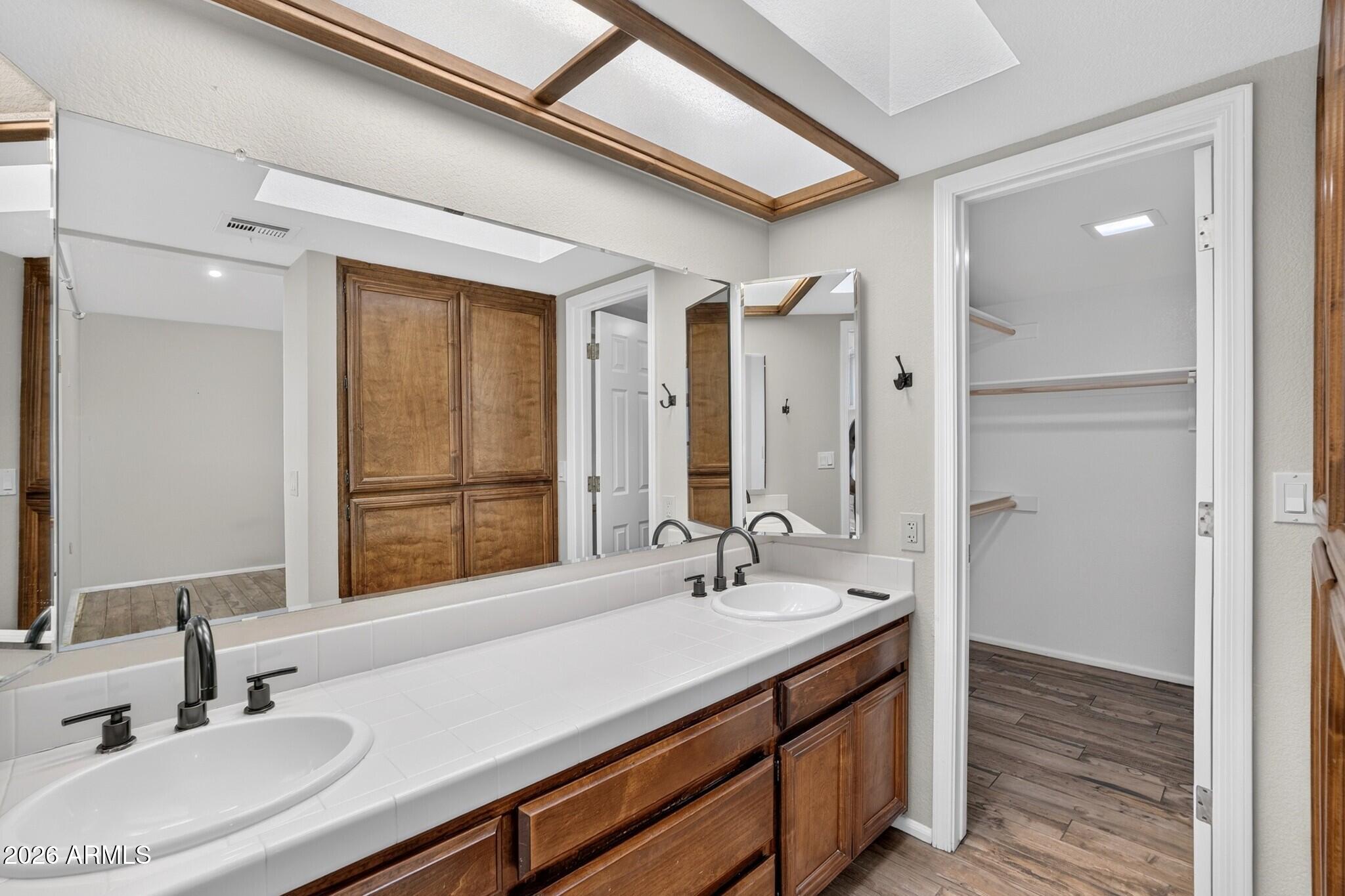 4615 East Monte Way Phoenix, AZ 85044 - Photo 19 of 35 a bathroom with a sink double vanity and a mirror