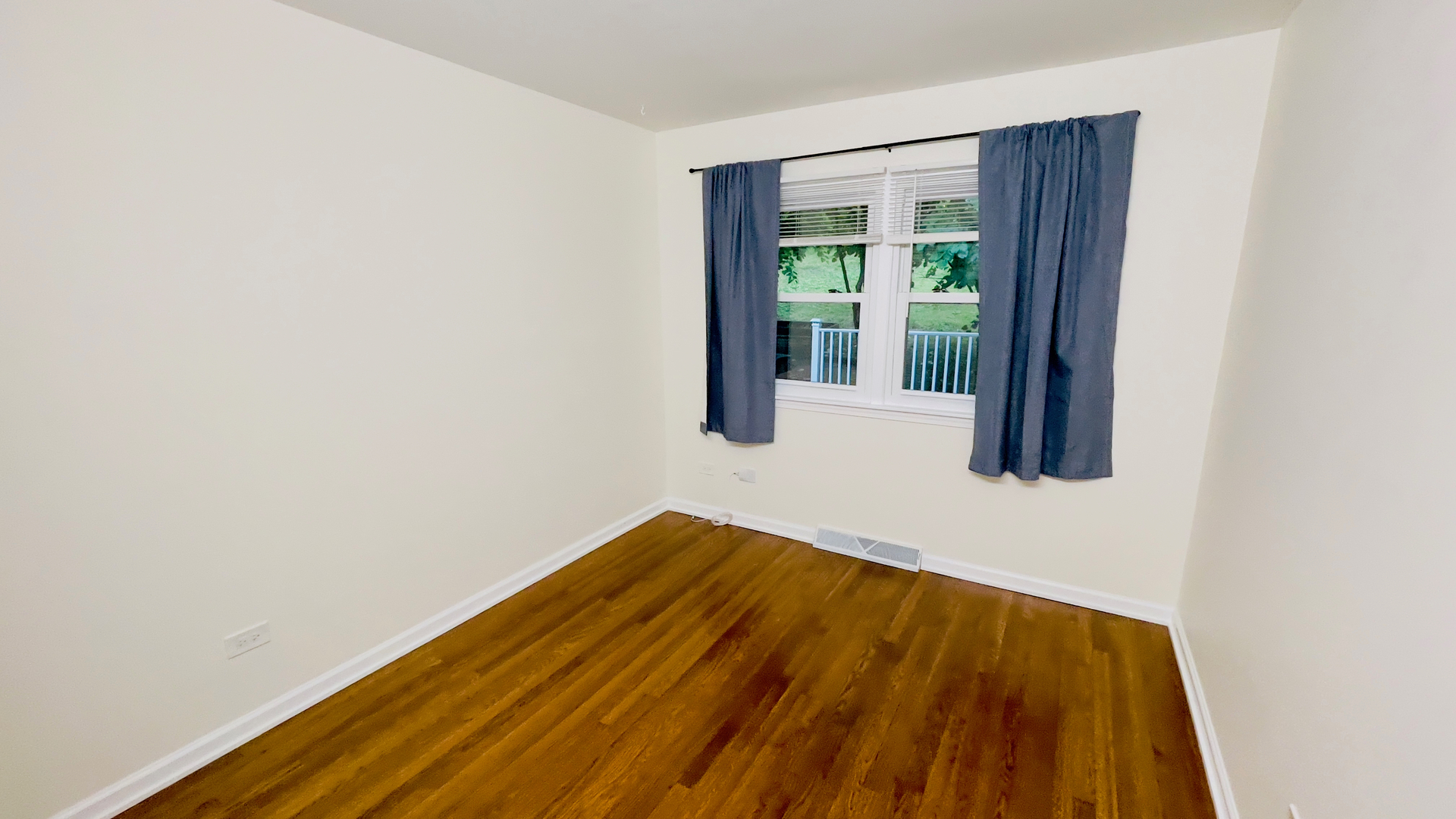 902 Woodland Road Wauconda, IL 60084 - Photo 15 of 28 a view of an empty room with wooden floor and a window