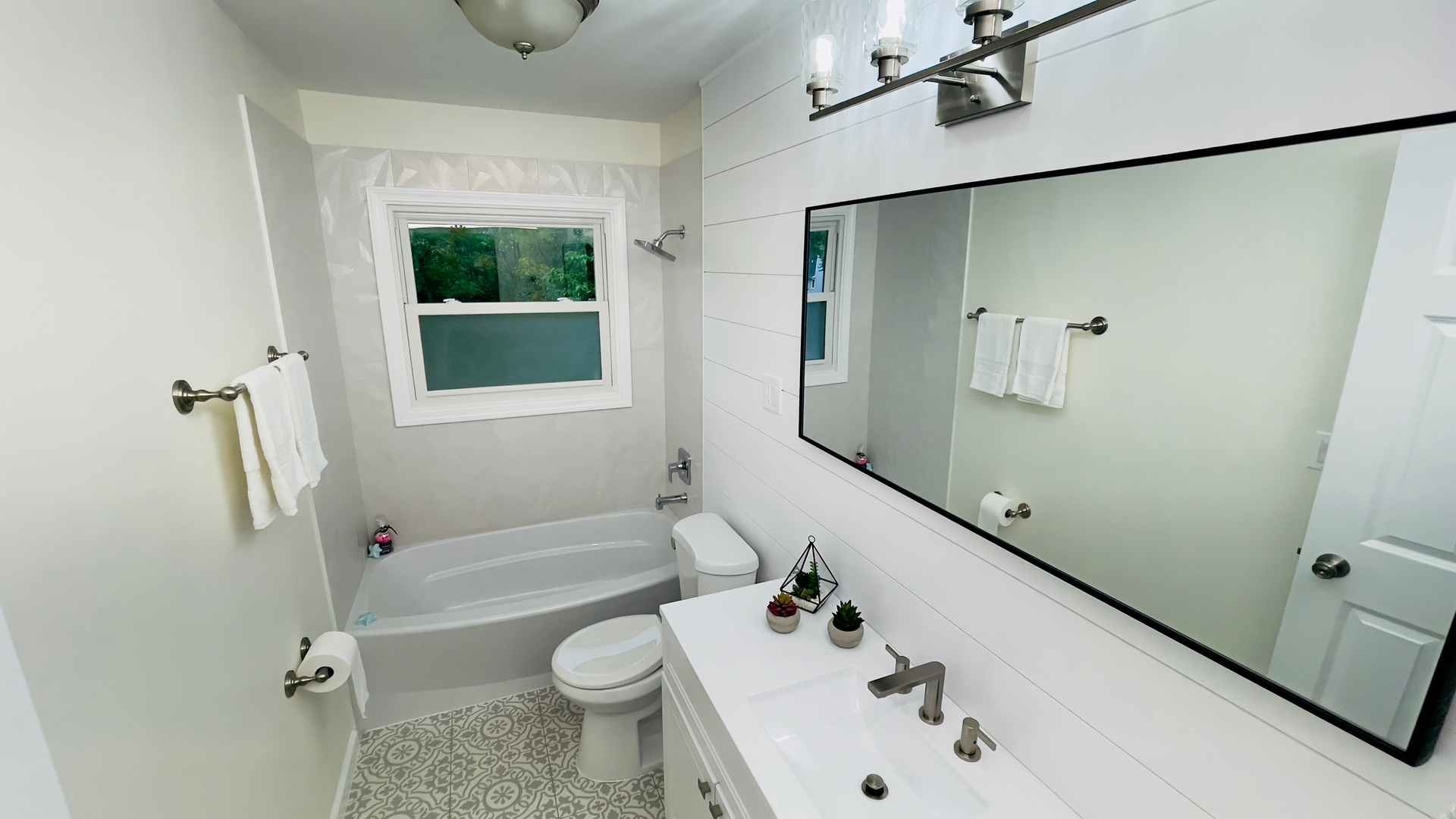 902 Woodland Road Wauconda, IL 60084 - Photo 16 of 28 a bathroom with a sink a toilet and shower