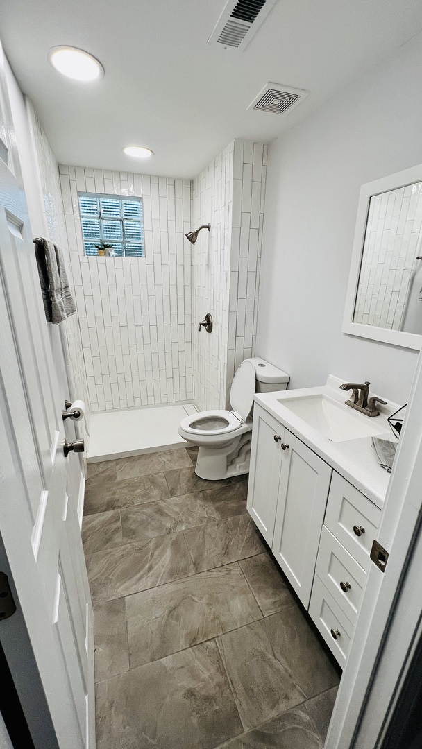 902 Woodland Road Wauconda, IL 60084 - Photo 23 of 28 a bathroom with a sink toilet and shower