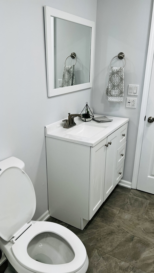 902 Woodland Road Wauconda, IL 60084 - Photo 25 of 28 a bathroom with a toilet a sink and vanity