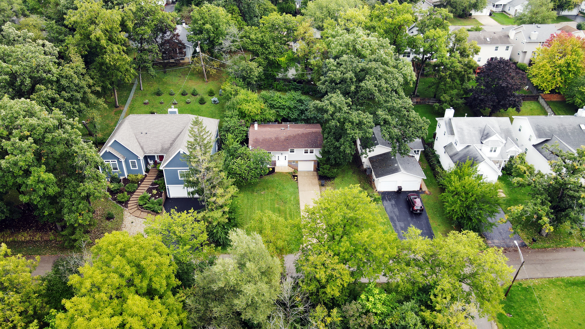 902 Woodland Road Wauconda, IL 60084 - Photo 26 of 28 an aerial view of a house with a yard and lake view