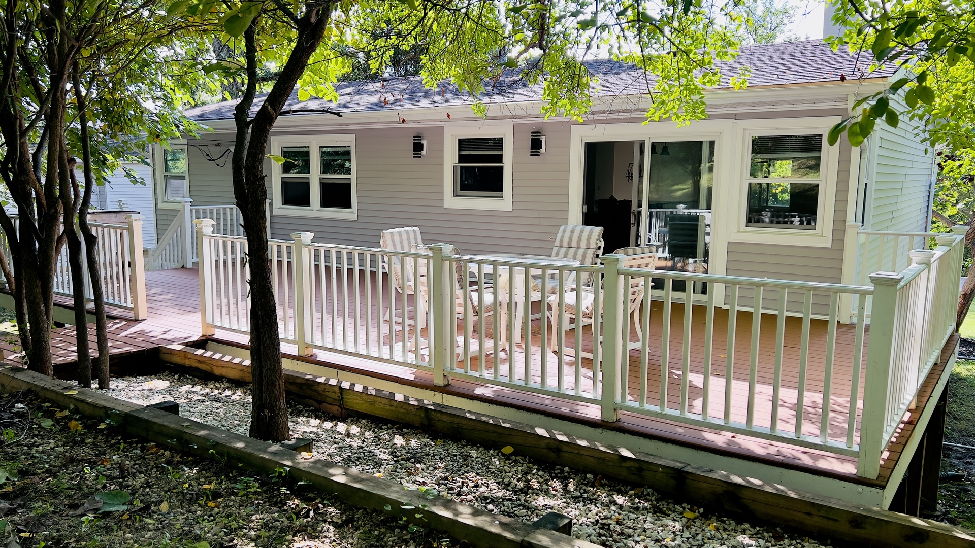 902 Woodland Road Wauconda, IL 60084 - Photo 4 of 28 a view of a house with a small yard and wooden fence