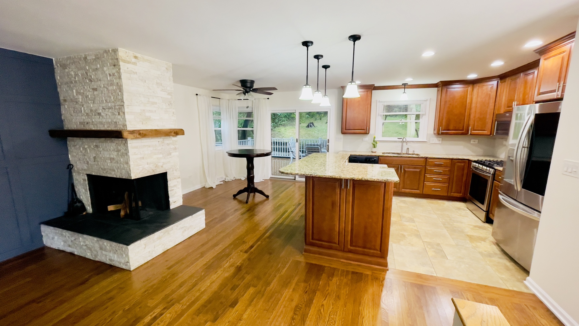 902 Woodland Road Wauconda, IL 60084 - Photo 7 of 28 a living room with furniture a fireplace and a flat screen tv