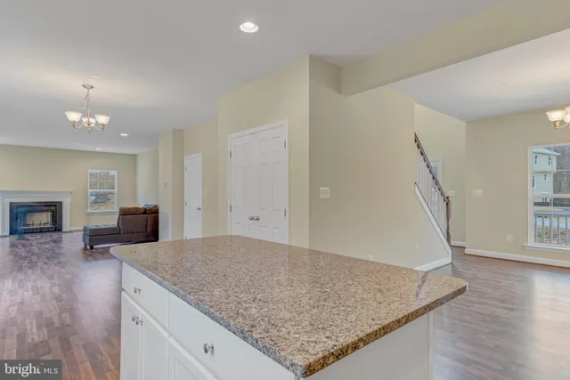 a view of a kitchen cabinets and wooden floor