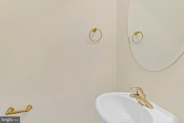 a bathroom with a sink and mirror