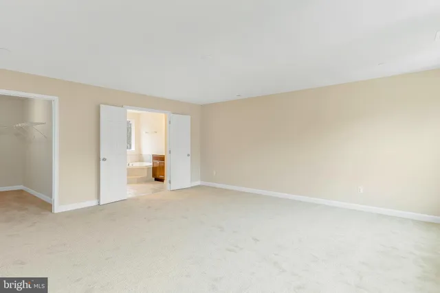 a view of an empty room and a window