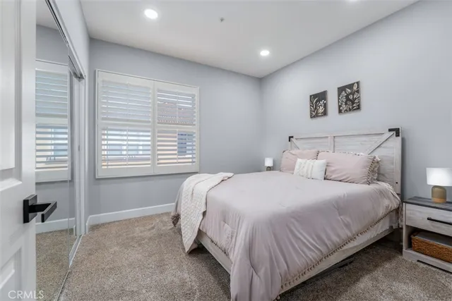 a bedroom with a bed and a cabinets