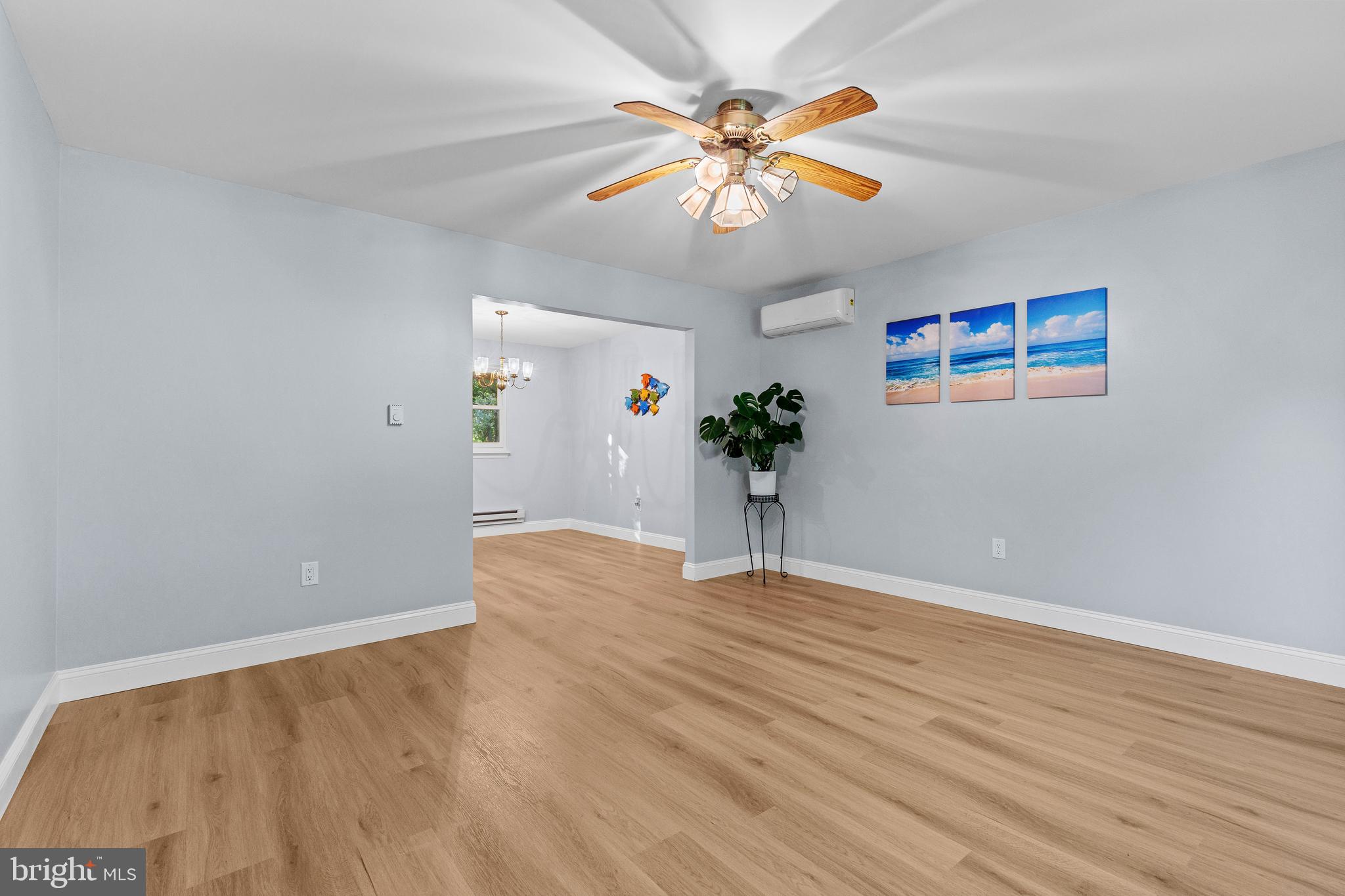4103 Forrest Road Mount Joy, PA 17552 - Photo 7 of 50 an empty room with wooden floor and chandelier
