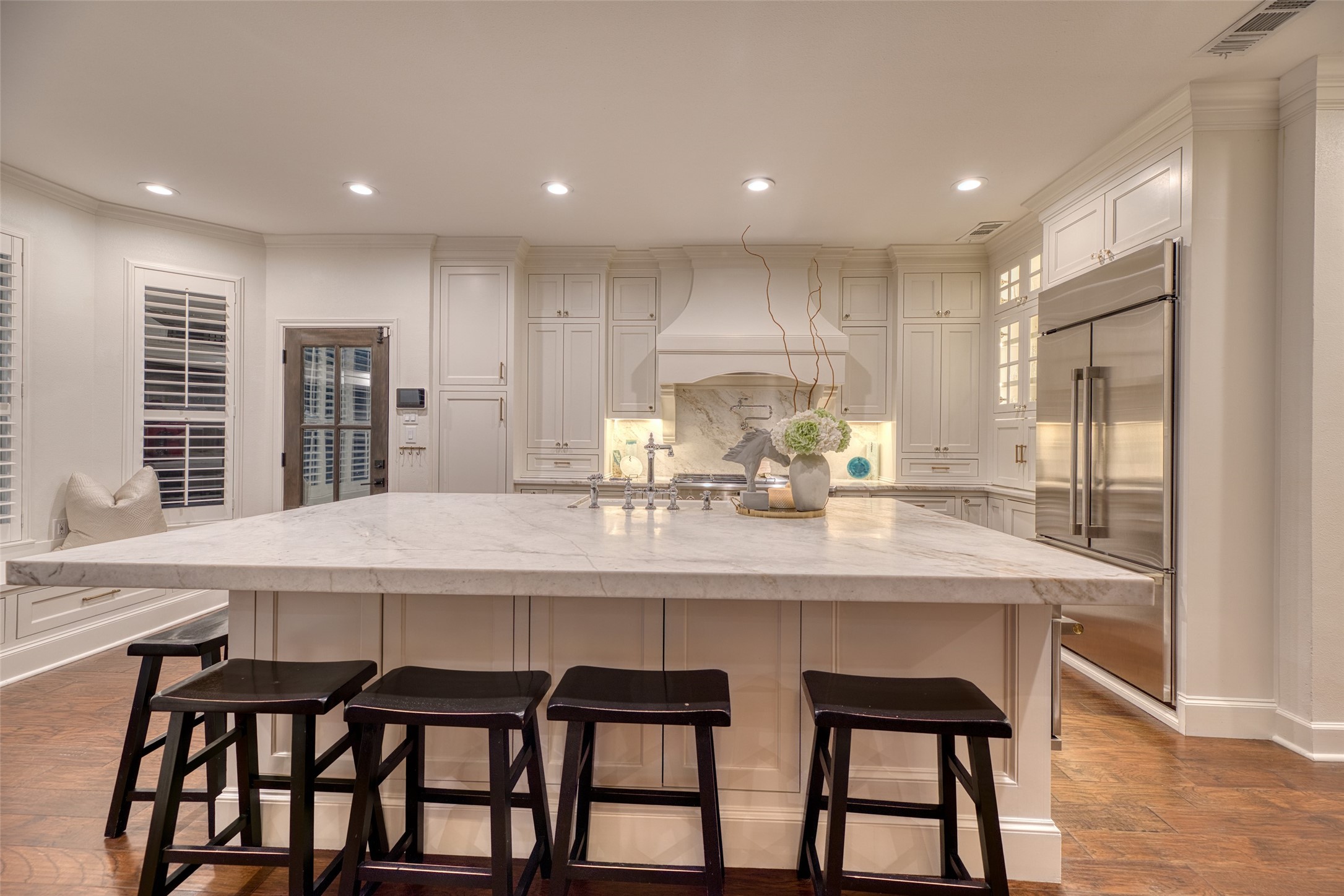 19522 Tamarack Way Houston, TX 77094 - Photo 12 of 50 a kitchen with a dining table chairs cabinets and stainless steel appliances