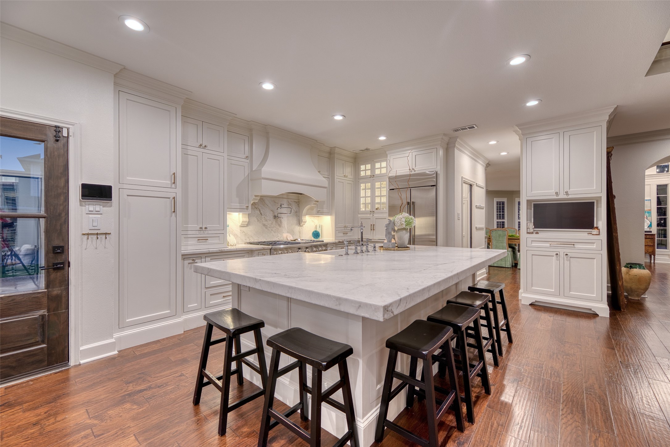19522 Tamarack Way Houston, TX 77094 - Photo 16 of 50 a kitchen with stainless steel appliances kitchen island granite countertop a table chairs sink and cabinets