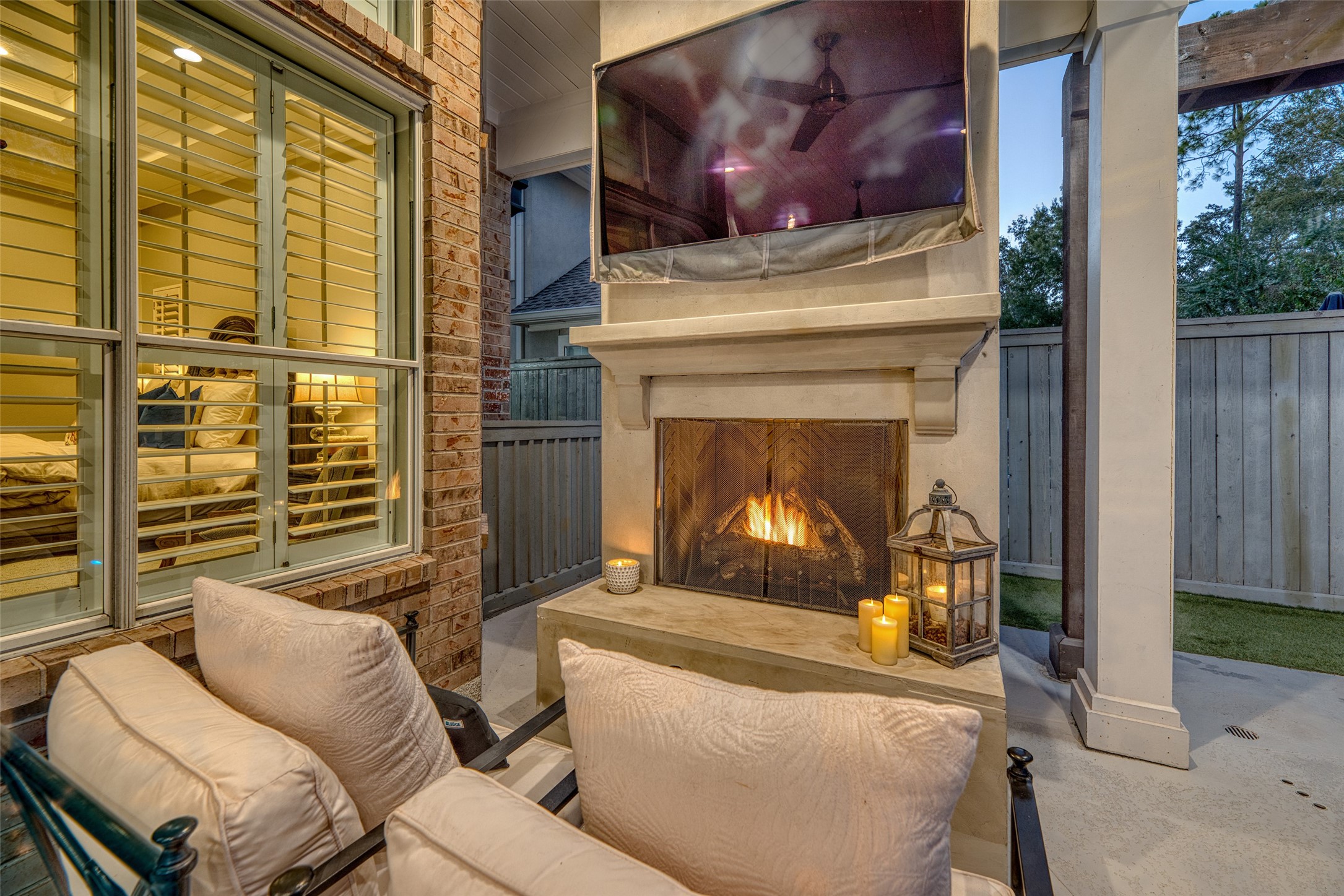 19522 Tamarack Way Houston, TX 77094 - Photo 39 of 50 a living room with furniture a fireplace and a floor to ceiling window