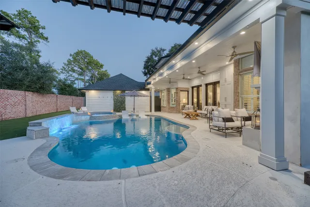 a view of pool table and chairs in patio