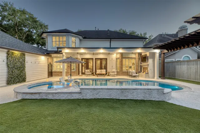 a living room with furniture and a swimming pool