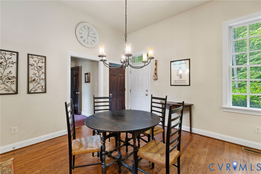 13173 Scotchtown Road Beaverdam, VA 23015 - Photo 27 of 65 a view of a dining room with furniture and wooden floor