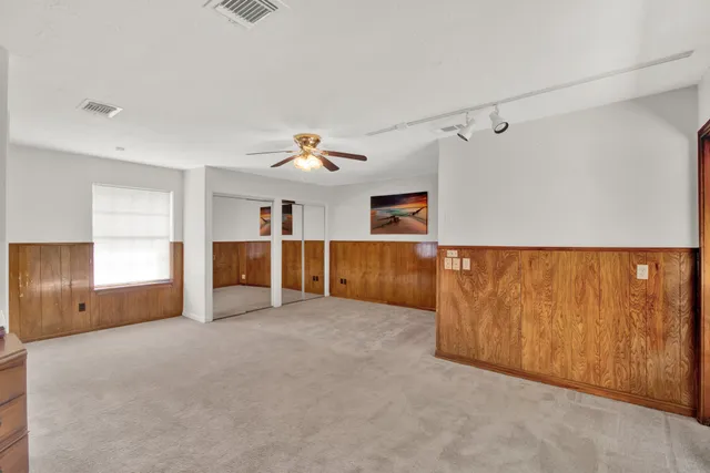 a view of livingroom with furniture and cabinet