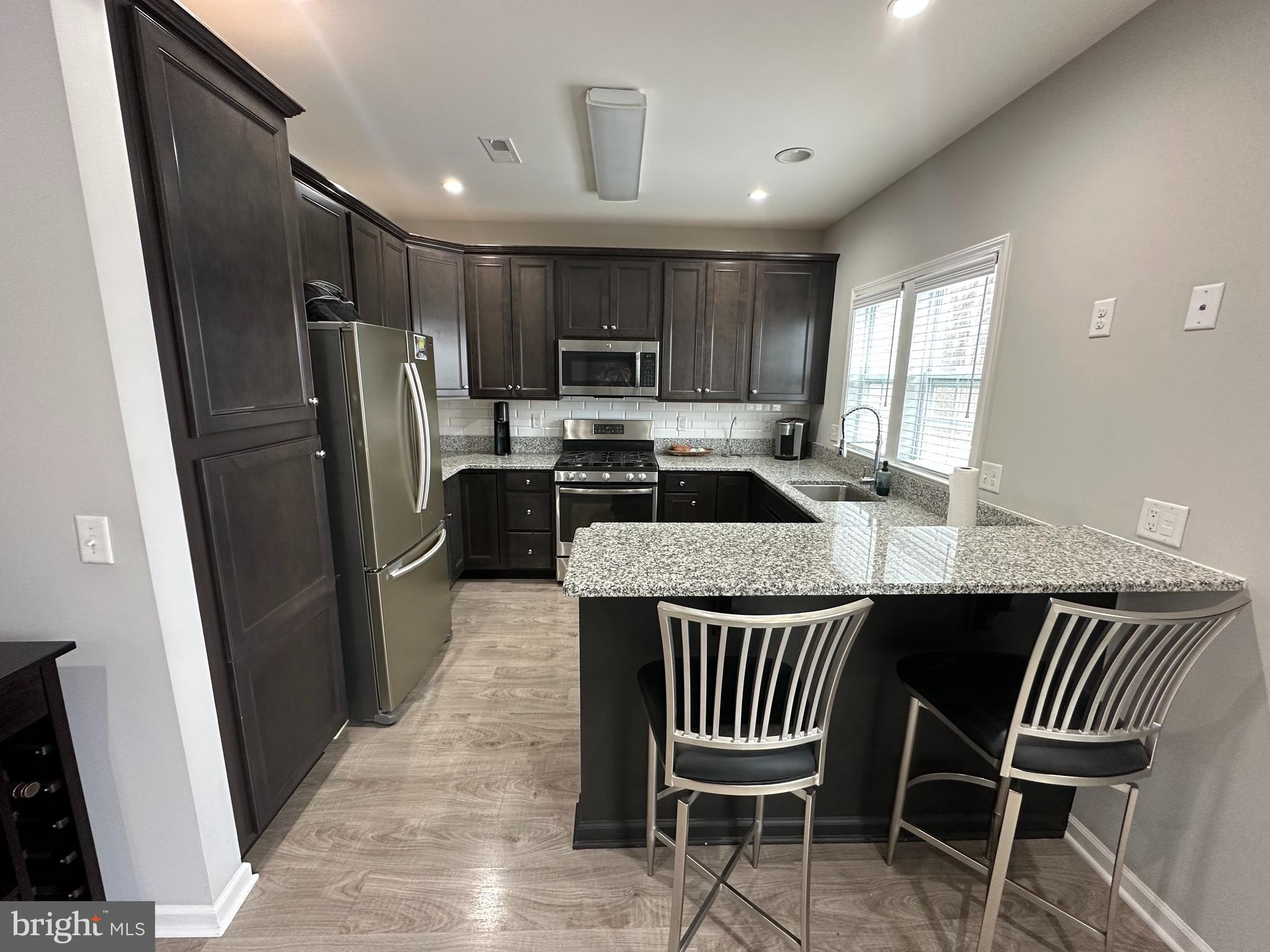 20 Canter Place Chesterfield, NJ 08515 - Photo 13 of 31 a kitchen with a table chairs refrigerator a sink and dishwasher
