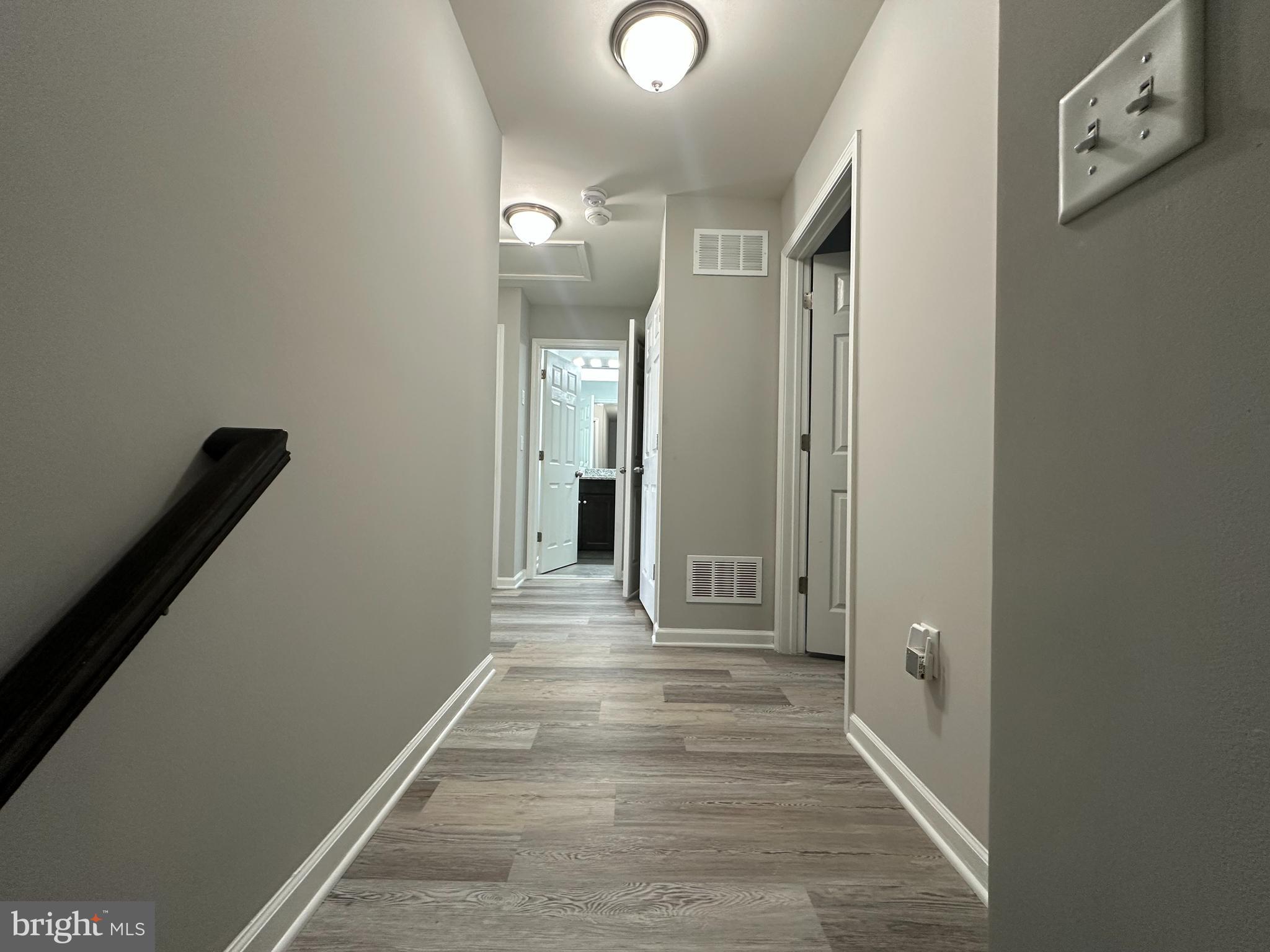 20 Canter Place Chesterfield, NJ 08515 - Photo 19 of 31 a view of a hallway with wooden floor and a bathroom