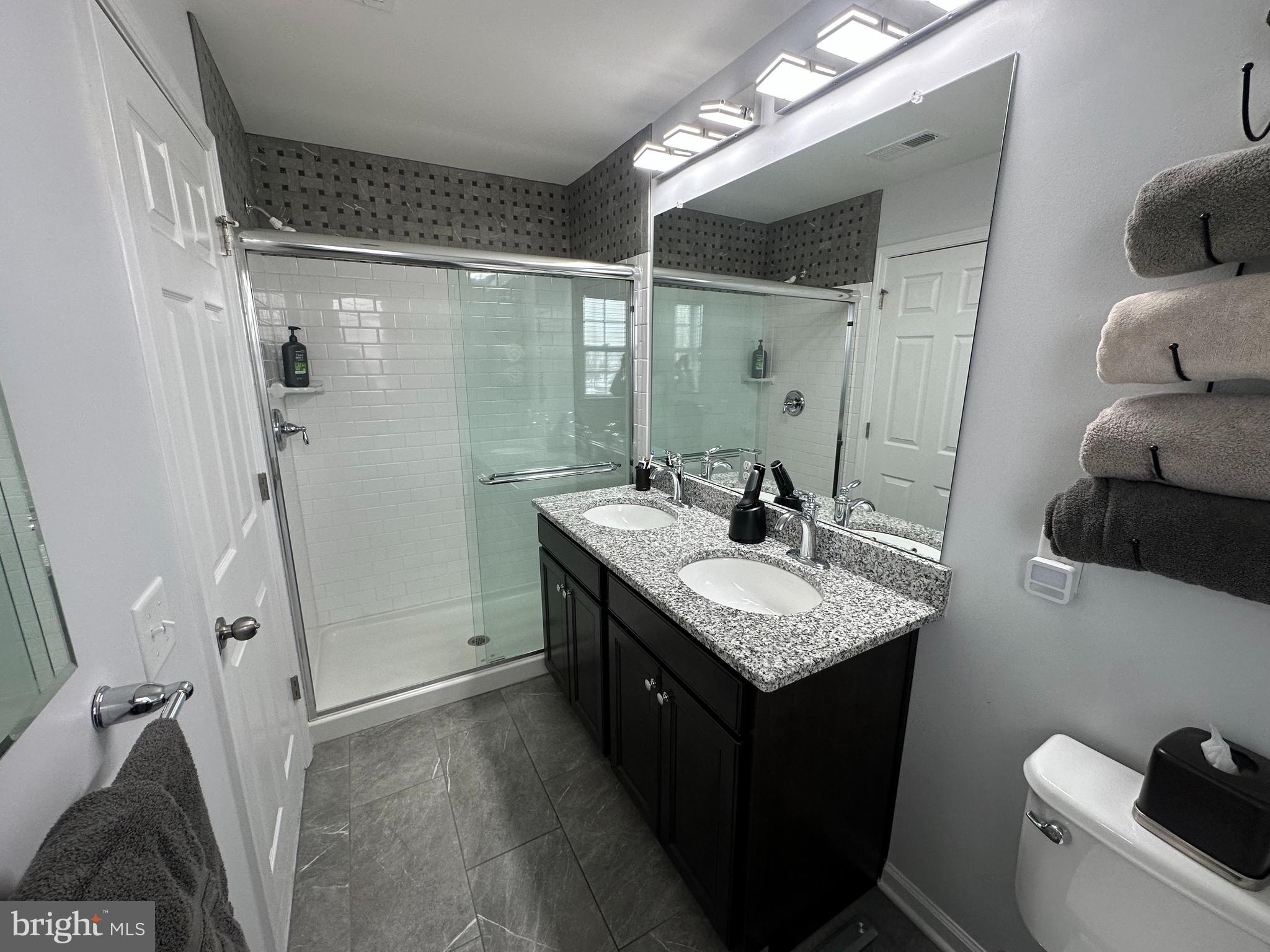 20 Canter Place Chesterfield, NJ 08515 - Photo 22 of 31 a bathroom with a granite countertop sink and a mirror