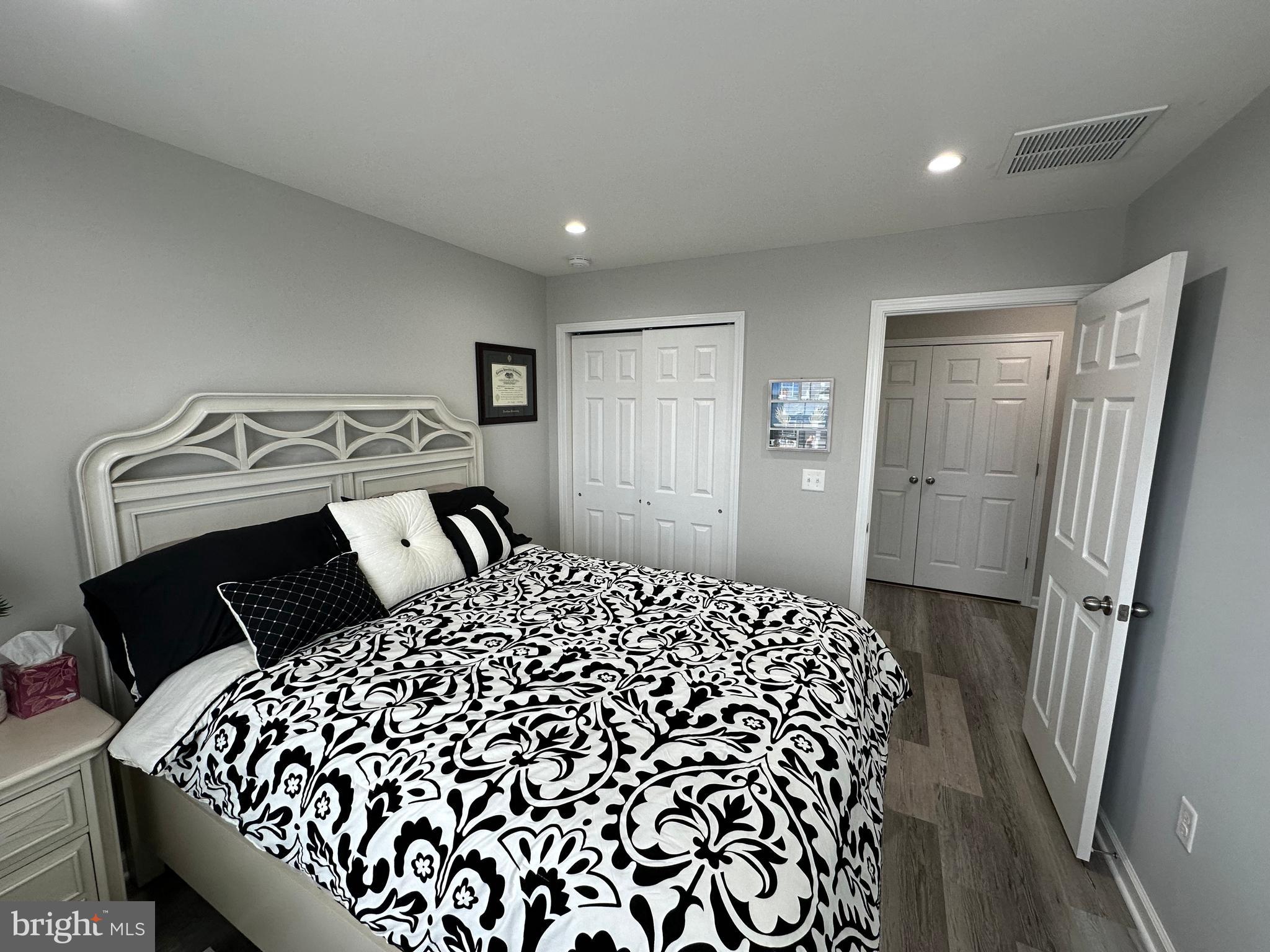 20 Canter Place Chesterfield, NJ 08515 - Photo 27 of 31 a bedroom with a bed and wooden floor