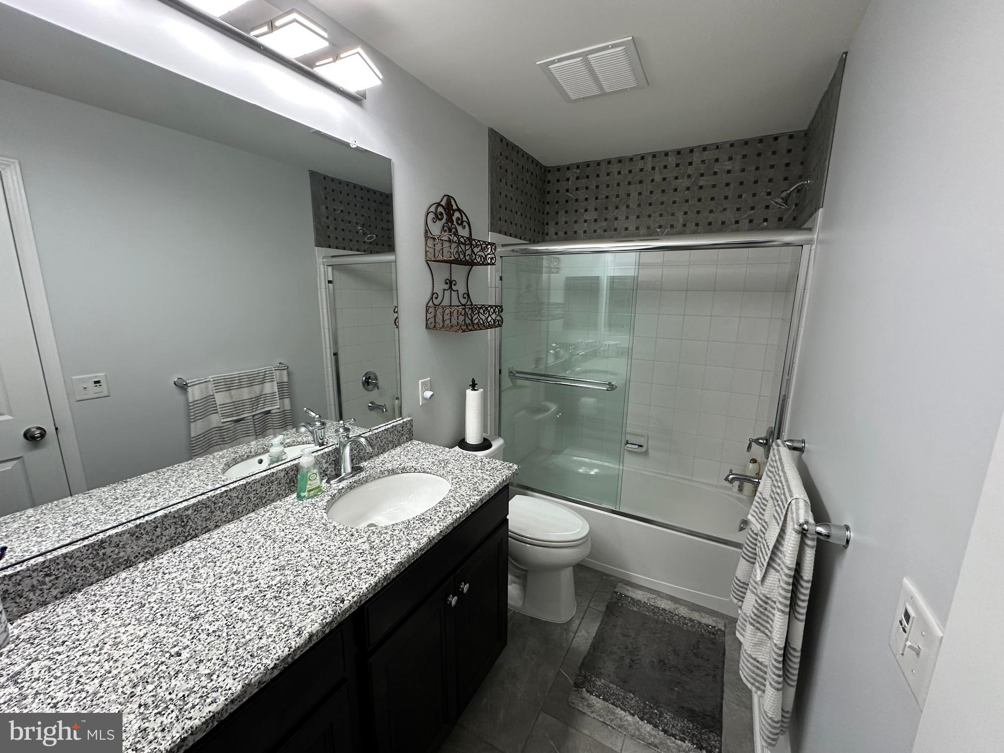 20 Canter Place Chesterfield, NJ 08515 - Photo 30 of 31 a bathroom with a granite countertop sink toilet and shower