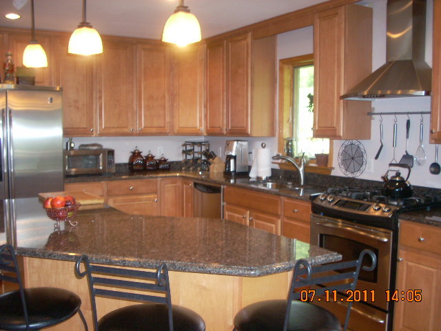 49 S Road Peru, MA 01235 - Photo 3 of 21 a kitchen with stainless steel appliances granite countertop a sink stove and cabinets