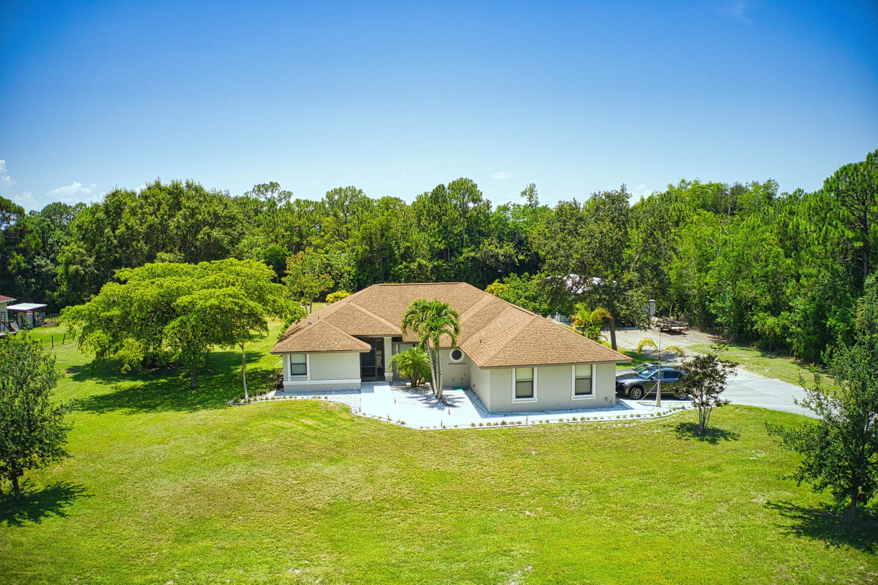 12386 170th Road North Jupiter, FL 33478 - Photo 1 of 21 Front Exterior Y