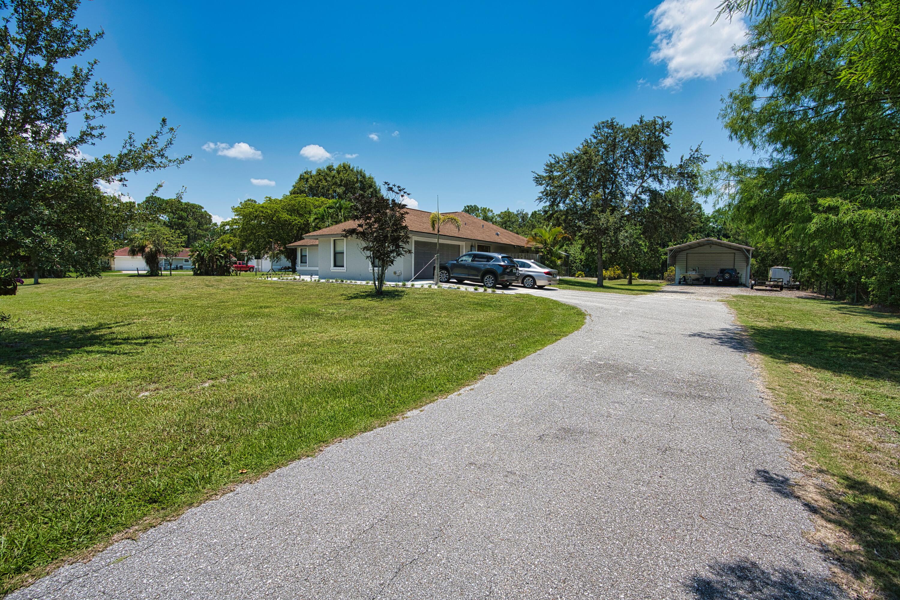 12386 170th Road North Jupiter, FL 33478 - Photo 18 of 21 Y Driveway