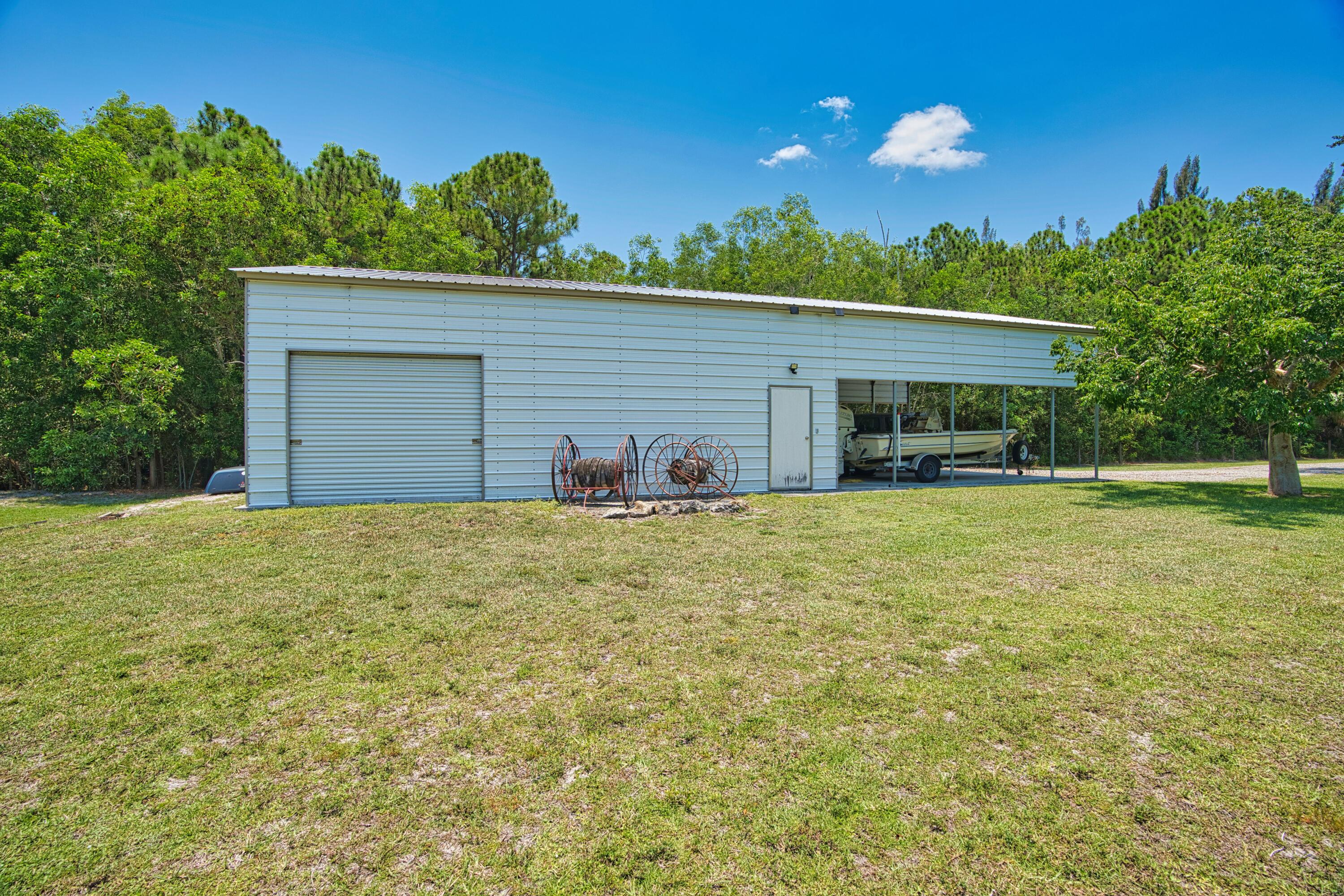 12386 170th Road North Jupiter, FL 33478 - Photo 20 of 21 Y Side of Workshop