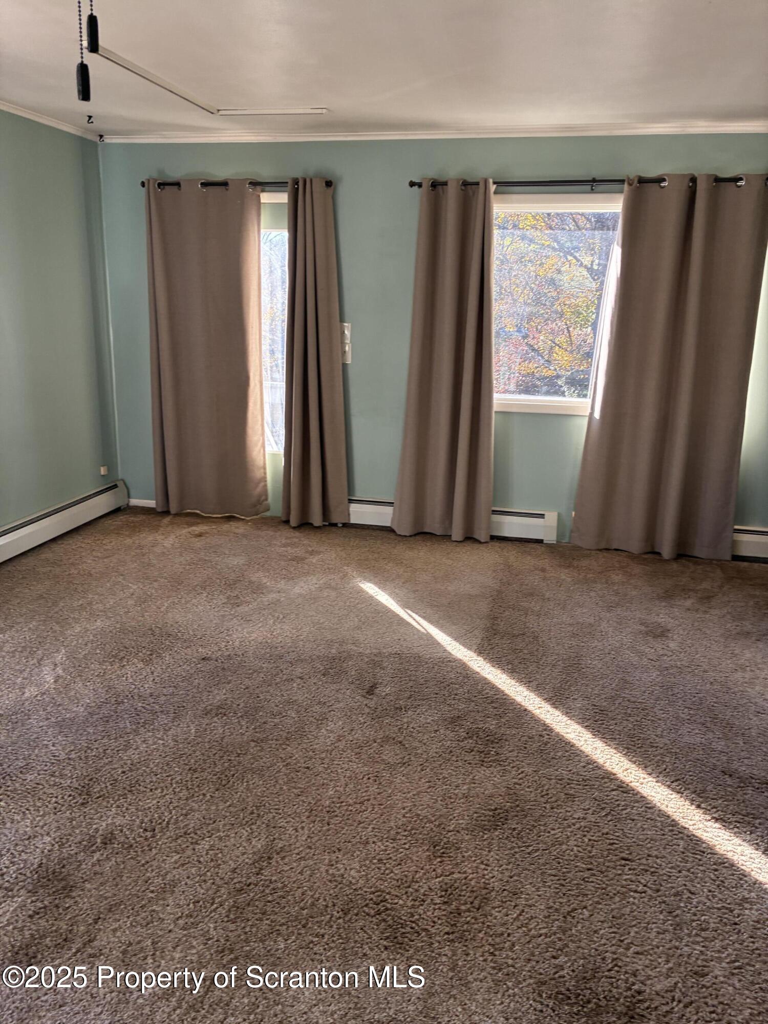 6295 Highway 706 Montrose, PA 18801 - Photo 6 of 11 an empty room with windows and closet