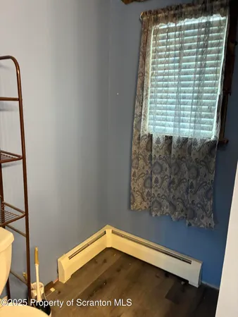 a view of a small space with racks on the wall