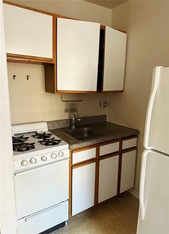 a kitchen with a stove and a microwave