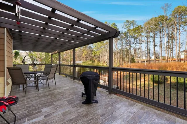 a view of a chairs and table in the patio