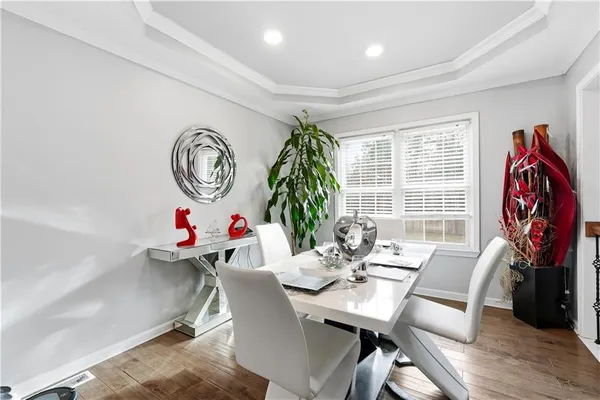 a view of a dining room with furniture window and wooden floor