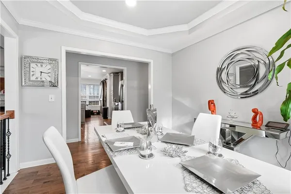 a dining room with kitchen island a table and chairs