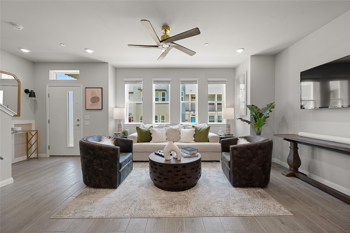 a living room with furniture potted plant and a window