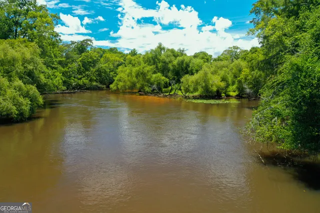 a view of a lake with a yard