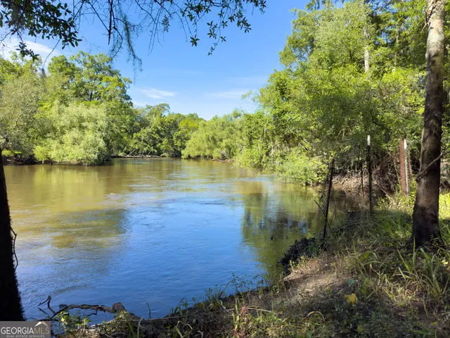 a view of swimming pool with a yard