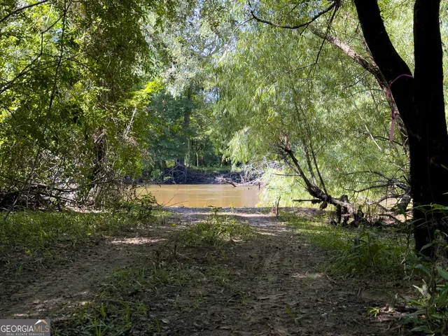 a view of swimming pool with a patio