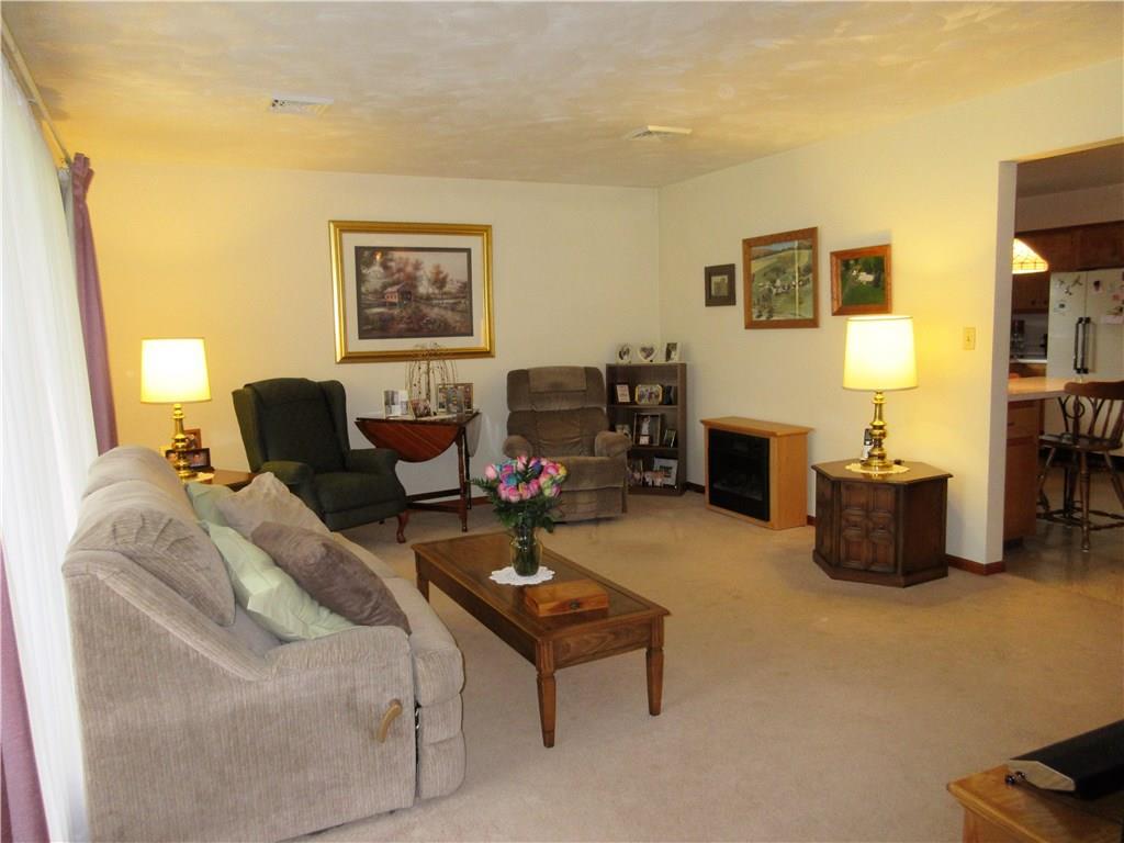 182 Ford City Road Freeport, PA 16229 - Photo 2 of 24 Large living room has plastered walls, an extra large window allowing plenty of natural light, and opens to kitchen /dining area.