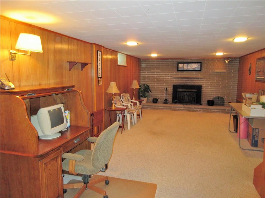 182 Ford City Road Freeport, PA 16229 - Photo 11 of 24 This 29x13 family room includes a brick, wood burning fireplace and recessed lighting.